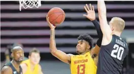  ?? JULIO CORTEZ/AP ?? Maryland guard Hakim Hart goes up for a shot against Michigan State forward Joey Hauser during a game Sunday in College Park.