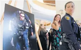  ?? AMY BETH BENNETT/SUN SENTINEL ?? Fort Lauderdale Police Detective Christophe­r Sheehan was eulogized with full honors funeral service at the Broward Center for the Performing Arts last August. in a