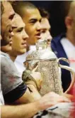  ??  ?? EDINBURGH: England’s captain Chris Robshaw holds up the The Calcutta Cup after defeating Scotland in their Six Nations rugby union internatio­nal match. —AP