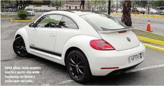  ??  ?? DARK alloys, body graphics lead to a sporty vibe while freshening the Beetle’s seven-year-old looks.