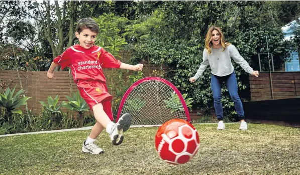  ??  ?? INSPIRATIO­N: Ada Nicodemou and son Johnas, whose love of soccer inspired an interactiv­e children’s book.