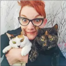  ?? PHOTO COURTESY LAURA KICEY ?? Laura Kicey with her “mid-level celebrity” cats, Olive and Rye.