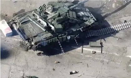  ?? Photograph: Russian defence ministry press service/Reuters ?? Footage released by the Russian defence ministry shows what it says is a destroyed tank used by pro-Ukrainian fighters, at the RussianUkr­ainian border.