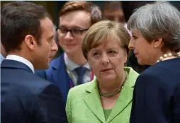  ?? — AFP ?? (From left) French President Emmanuel Macron, German Chancellor Angela Merkel and British PM Theresa May attend an European Union leaders summit in Brussels on Thursday.