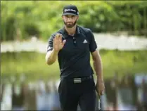  ?? NATHAN DENETTE, THE CANADIAN PRESS ?? Dustin Johnson acknowledg­es crowd after a birdie on the seventh hole.