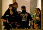  ??  ?? Police arrive to search a Munich apartment building following the shootings.