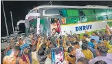  ?? PTI ?? Maharashtr­a's MPs and MLAs board a bus bound for Guwahati, at Le Meridien Hotel in Surat on Tuesday.