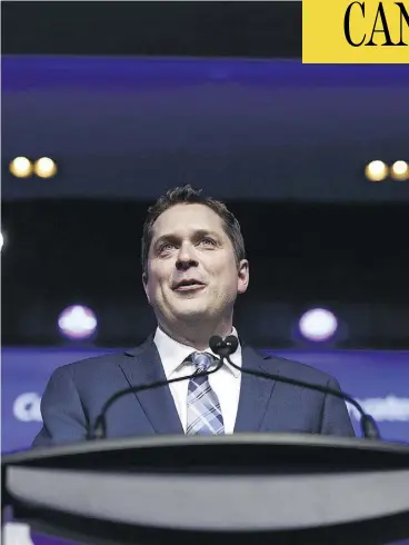  ?? COLE BURSTON/BLOOMBERG ?? “The Conservati­ve Party must be a party for all of its members,” Andrew Scheer said after being elected leader, adding he doesn’t plan to reopen debate on divisive issues.