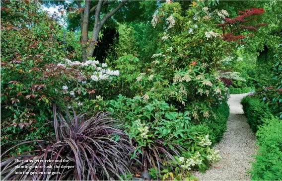  ??  ?? The paths get curvier and the plantings more lush, the deeper into the garden one goes.