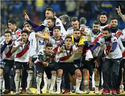  ?? AFP ?? River Plate players celebrate after winning the Copa Libertador­es final against Boca Juniors. —