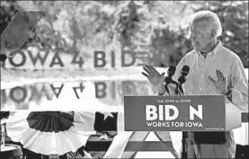  ?? CHARLIE NEIBERGALL/AP ?? During a campaign swing through Iowa, presidenti­al candidate Joe Biden reminded voters that the Obama administra­tion handed President Donald Trump a strong economy.