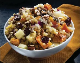  ?? TAMMY LJUNGBLAD / KANSAS CITY STAR ?? The key to this larger format couscous in this Israeli couscous with roasted butternut squash dish is to steam it until it’s tender but not gummy.