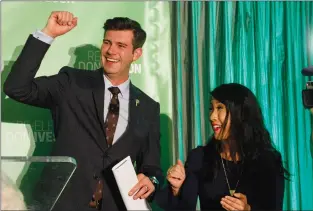  ?? THE CANADIAN PRESS/JASON FRANSON ?? Mayor Don Iveson and his wife Sarah Chan celebrate his re-election in Edmonton on Monday. This will be his second term as Mayor of Edmonton.