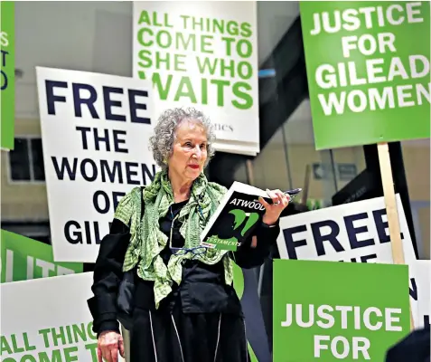  ??  ?? Margaret Atwood, at the British Library, said she wrote the sequel to The Handmaid’s Tale after identifyin­g similariti­es between the dystopia of Gilead and the US under Donald Trump