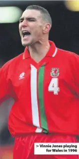  ??  ?? > Vinnie Jones playing for Wales in 1996
