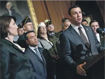  ?? Win McNamee Getty Images ?? REP. DUNCAN HUNTER, shown in 2014, replaced his father in Congress in 2009 and won his last election by nearly 27 percentage points. But he’s also the subject of a probe into whether he misused campaign funds.