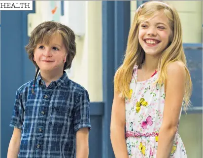  ??  ?? Positive: Lucy Ritchie, right, was born with no cheekbones, ears or jaw. Jacob Tremblay as Auggie and Elle Mckinnon as Charlotte in the film Wonder, left
