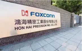  ?? EPA PIC ?? Foxconn says third-quarter net profit tumbled to T$21 billion, its first quarterly decline in a year.