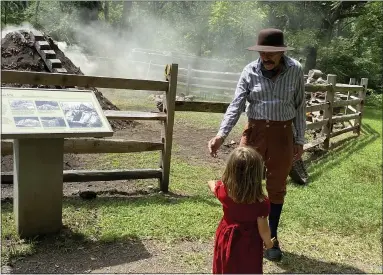  ?? LISA SCHEID — READING EAGLE ?? Rick Wolf, 80, of Phoenixvil­le portrays a collier at the charcoal pit Saturday at Hopewell Furnace National Historic Site in Union Township. Wolf, a retired national park ranger, supervised at Hopewell in the 1990s. The park’s event Saturday marked the 150th anniversar­y of the furnace and the 83rd anniversar­y of the park.