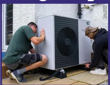  ?? ?? ALL CHANGE: Installers fit a heat pump to a 1930s-built home in Folkestone last month