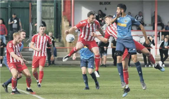  ??  ?? A local nonleague football match, with a crowd remember them?