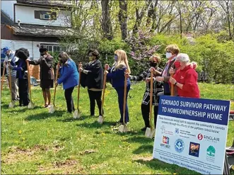  ??  ?? Trotwood city leaders, Montgomery County commission­ers and community partners prepare to break ground on a new home for a family impacted by the 2019 Memorial Day tornado.