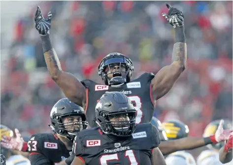  ?? LEAH HENNEL/ POSTMEDIA NETWORK ?? Calgary running back Jerome Messam celebrates his touchdown during the Stampeders’ win over the Edmonton Eskimos Sunday in the CFL Western Final action at McMahon Stadium in Calgary.