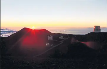  ?? COURTESY OF REX CRUM ?? Sunset from the summit of Mauna Kea, with some of the 13 telescopes on the mountain in the foreground.