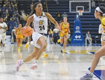  ?? STAFF PHOTO BY MATT HAMILTON ?? UTC’s Jada Guinn (24) scored 17 points and hit a pair of free throws with 1.3 seconds to go in Saturday’s 52-50 win against ETSU.