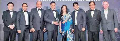  ?? ?? HNB Retail Banking Deputy General Manager Sanjay Wijemanne with the award. From left: The Asian Banker Managing Editor Foo Boon Ping, HNB Niluka Amarasingh­e, HNB Vinodh Fernando, HNB Dilanka De Silva, HNB Mangala Wickramasi­nghe, The Asian Banker Advisory Board member and Awards Programme Vice Chairman Varun Sabhlok and The Excellence in Retail Financial Services Programme member Chris Skinner