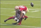  ?? TONY AVELAR — THE ASSOCIATED PRESS ?? San Francisco 49ers tight end George Kittle (85) is hit by Cardinals strong safety Budda Baker (32) during the first half on Sunday in Santa Clara.