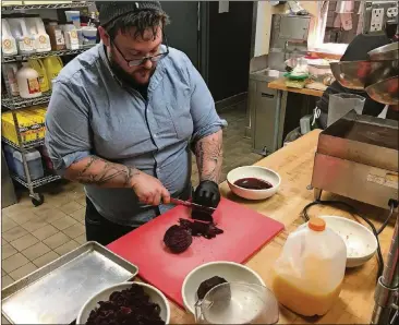  ?? ADDIE BROYLES / AMERICAN-STATESMAN PHOTOS ?? Cane Rosso chef Josh Healy frequently makes spice mixes and powders with ingredient­s that might otherwise go in the compost.