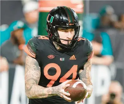  ?? WILFREDO LEE/AP ?? Miami’s Lou Hedley prepares to punt during a game against North Carolina State last season in Miami Gardens.