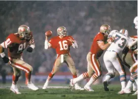  ?? Focus On Sport / Getty Images 1985 ?? Joe Montana gets set to pass in Super Bowl XIX, in which the 49ers beat Miami 38-16 at Stanford Stadium. Montana was named the game’s MVP.