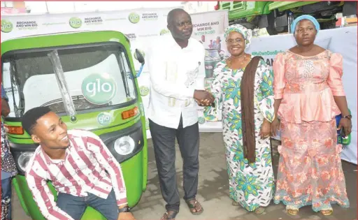  ??  ?? Secretary to Lagos State Government, Mrs Folashade Jaji (second right) congratula­ting Ndidi Okpuzor, one of the keke winners in the on-going Globacom’s Recharge and Win promo (My Own Don Beta), while other winners Aminat Afeez (right) and Joel Ndifreke (first left) watch with admiration at the first presentati­on of prizes by Globacom in Ojuelegba, Surulere Lagos...recently