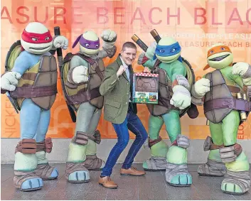  ?? ?? New deal Michael Harkins, Turtle Pack founder, with the Teenage Mutant Ninja Turtles