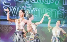  ??  ?? This photo on April 22, shows women performing traditiona­l dance on stage during the Annual Red Cross festival in the restive southern Thai province of Narathiwat. — AFP photo