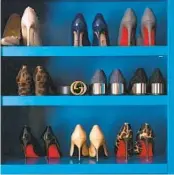  ?? LAURA VISIONI ?? Open storage works well for shoes. Designer Erin Myers painted with Benjamin Moore’s Deep Ocean.