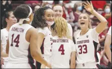  ?? Associated Press ?? Stanford guard Hannah Jump (33) celebrates with teammates after making a 3-pointer against Morgan State during the second half of on Thursday in Stanford. Stanford won 91-36.