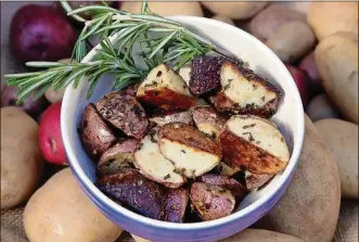  ?? PHOTOS BY HILLARY LEVIN / ST. LOUIS POST-DISPATCH ?? Rosemary-roasted potatoes are extra-wonderful because of a few simple ingredient­s that add so much to the overall dish.