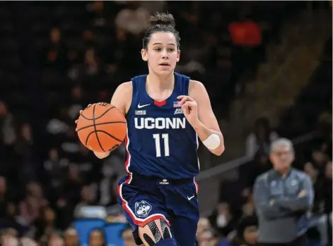  ?? Terrance Williams/Associated Press ?? UConn’s Lou Lopez Senechal brings the ball upcourt during the first half against Georgetown on Feb. 11.