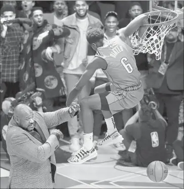  ?? Gerry Broome Associated Press ?? OKLAHOMA CITY’S Hamidou Diallo leaps over Shaquille O’Neal on his way to winning the slam dunk title at Charlotte, N.C. The dunk contest might have been surpassed by the three-point competitio­n.