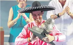  ?? REUTERS ?? Rafael Nadal celebrates with the Mexico Open trophy in Acapulco.