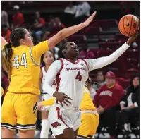  ?? (NWA Democrat-Gazette/J.T. Wampler) ?? Arkansas’ Erynn Barnum (4) puts up a shot in front of Kent State’s Lindsey Thall on Thursday during the Razorbacks’ 80-59 victory at Walton Arena in Fayettevil­le. Barnum finished with 20 points and six rebounds.