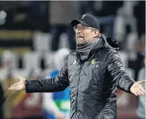  ?? PHOTO: REUTERS ?? Get on with it . . . Liverpool coach Jurgen Klopp urges his players on during the Champions League game against Red Star Belgrade in Belgrade yesterday. Liverpool lost 20.