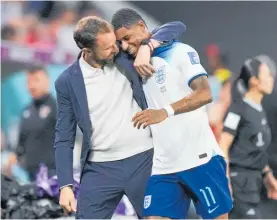  ?? Photo / AP ?? England hero Marcus Rashford, right, is greeted by England’s head coach Gareth Southgate as he leaves the pitch.