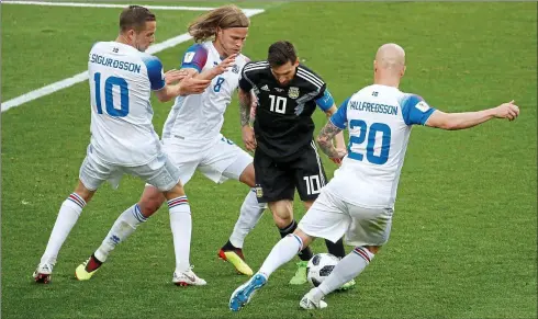  ??  ?? No way through: Iceland swamp Lionel Messi during last Saturday’s 1-1 draw against Argentina