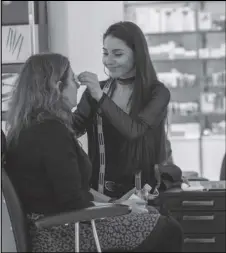  ?? Associated Press ?? In this Nov. 26 photo, a beautician is shown shaping a customer’s eyebrow at the Nordstrom NYC Flagship in New York.