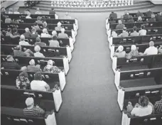  ?? JOHN TAGGART, EUROPEAN PRESSPHOTO AGENCY ?? A prayer service in Orlando last month honors the victims of the mass shooting at a gay nightclub. The Newseum survey on faith and the First Amendment reflects a shift after the attack.