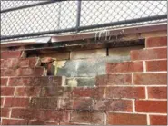  ?? DIGITAL FIRST MEDIA FILE PHOTO ?? Engineer Tom Slowik told the school board that some brick must be replaced and re-pointed, as well as being better attached to the wall behind it, and that more and better flashing is needed to keep gain penetratin­g the structure.